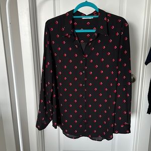 Ricki’s button-up blouse.